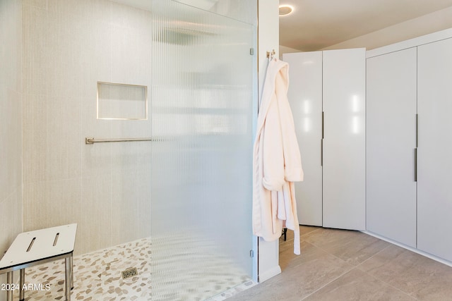 bathroom featuring a shower and tile patterned floors