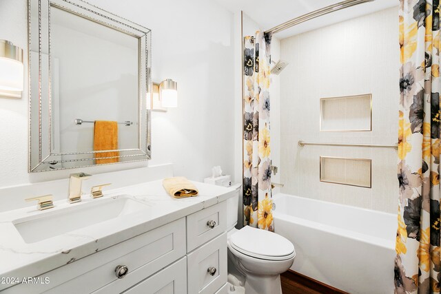 full bathroom with wood-type flooring, vanity, toilet, and shower / bath combo