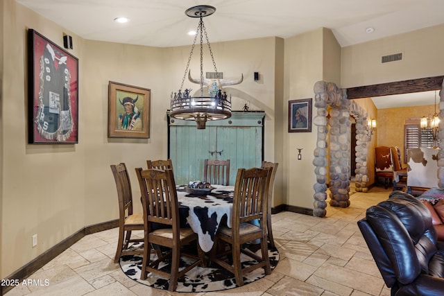 21230 S 156th St, Gilbert, AZ 85298 - dining room with a chandelier, stone tile flooring, baseboards, lofted ceiling, and recessed lighting