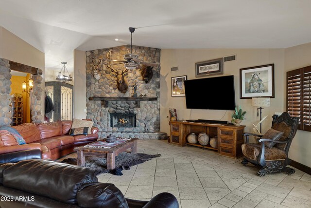 21230 S 156th St, Gilbert, AZ 85298 - living room with vaulted ceiling, a stone fireplace, and baseboards