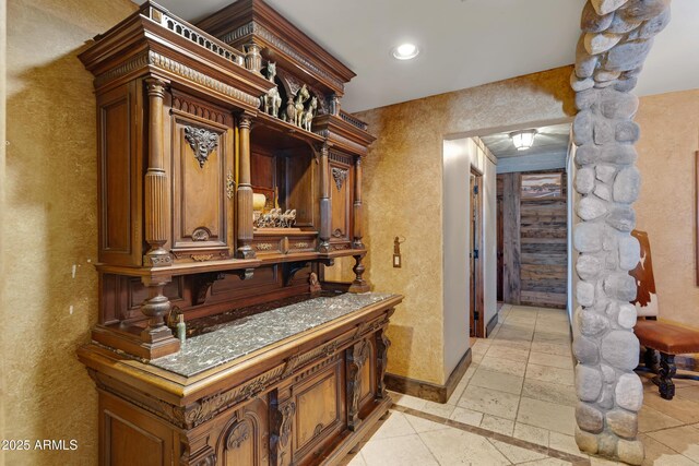 21230 S 156th St, Gilbert, AZ 85298 - interior space featuring a textured wall, baseboards, recessed lighting, and stone tile flooring
