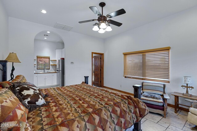 21230 S 156th St, Gilbert, AZ 85298 - bedroom featuring arched walkways, freestanding refrigerator, baseboards, recessed lighting, and a ceiling fan