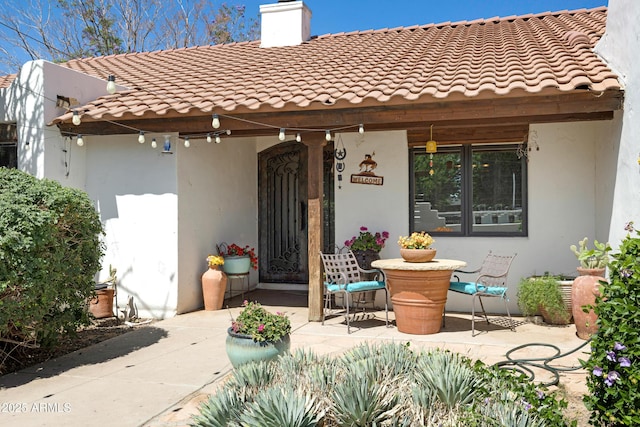 21230 S 156th St, Gilbert, AZ 85298 - view of front of property featuring a chimney, a tile roof, and stucco siding