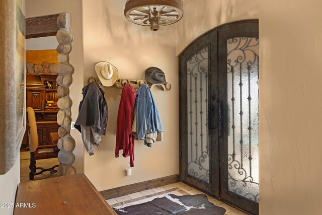 21230 S 156th St, Gilbert, AZ 85298 - foyer entrance with french doors, tile patterned flooring, baseboards, and a chandelier