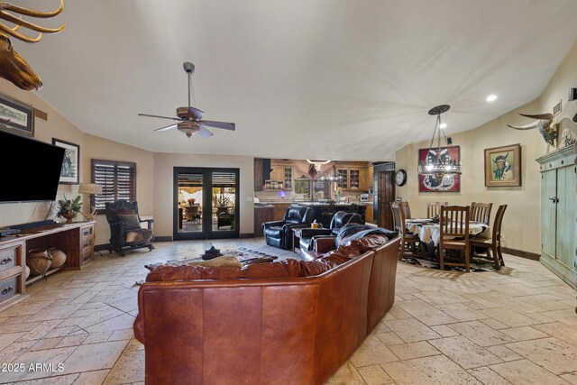 21230 S 156th St, Gilbert, AZ 85298 - living room with stone tile floors, vaulted ceiling, a ceiling fan, recessed lighting, and baseboards