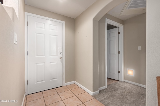 interior space with light tile patterned floors