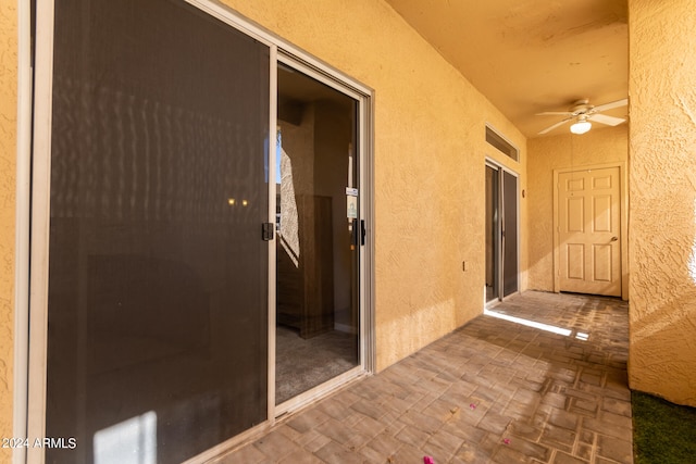 exterior space featuring ceiling fan