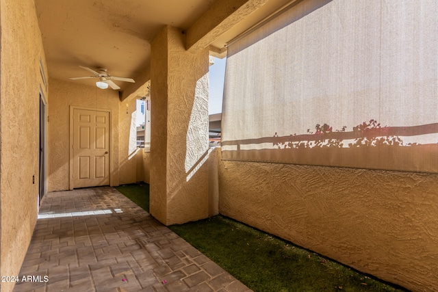 exterior space featuring ceiling fan