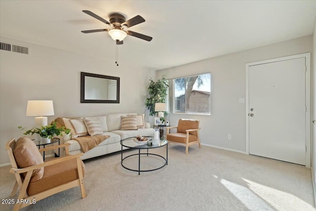 living room with light colored carpet and ceiling fan