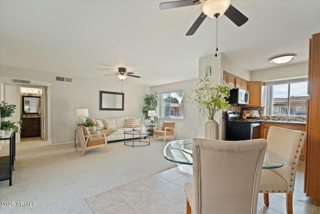 carpeted living room with a wealth of natural light