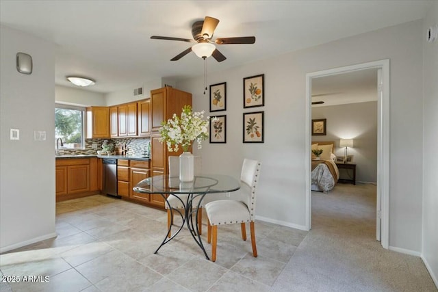 tiled dining space featuring ceiling fan