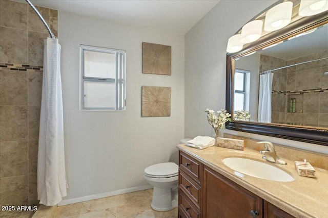 bathroom featuring a shower with curtain, vanity, and toilet