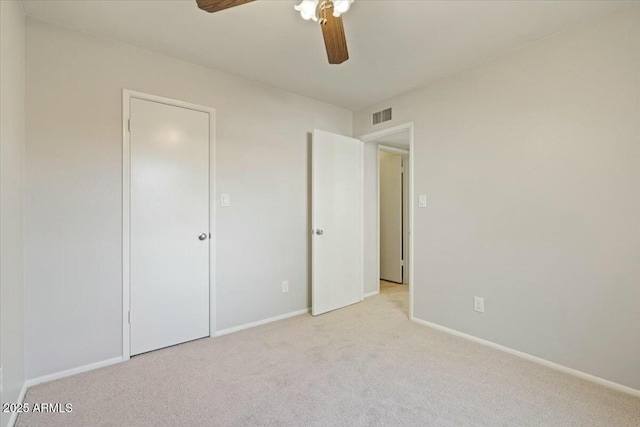 unfurnished bedroom with light carpet and ceiling fan