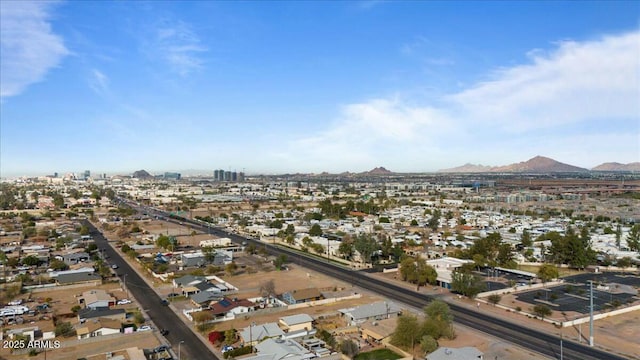 birds eye view of property with a mountain view