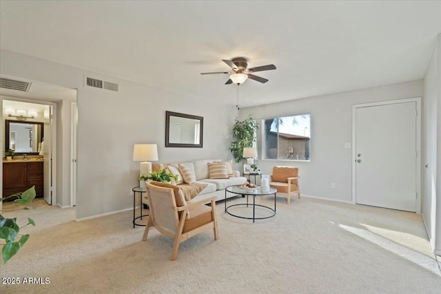 living room with light carpet and ceiling fan