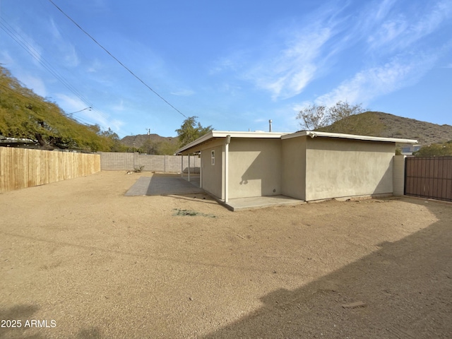 back of property featuring a patio