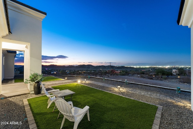 yard at dusk with a mountain view