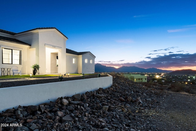 view of property exterior at dusk