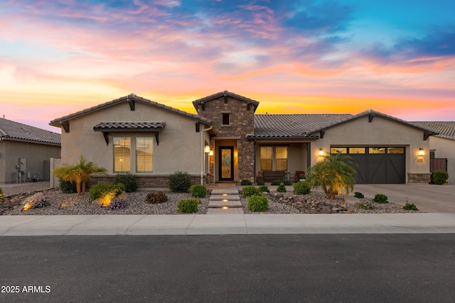 1958 E Bellflower Ct, Gilbert, AZ 85298 - view of front of home featuring stone siding, stucco siding, an attached garage, concrete driveway, and a tile roof