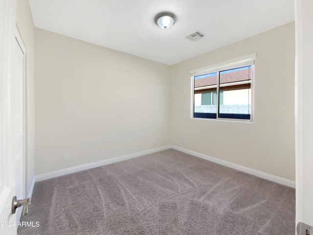 unfurnished room with carpet floors