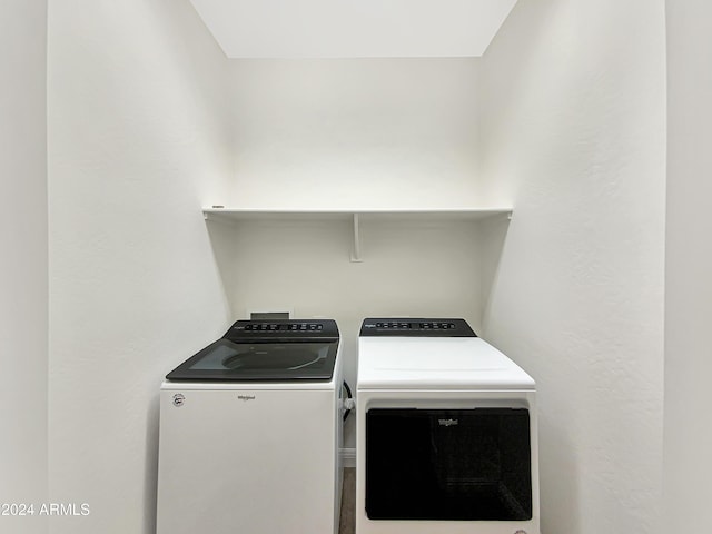 laundry room featuring washer and clothes dryer