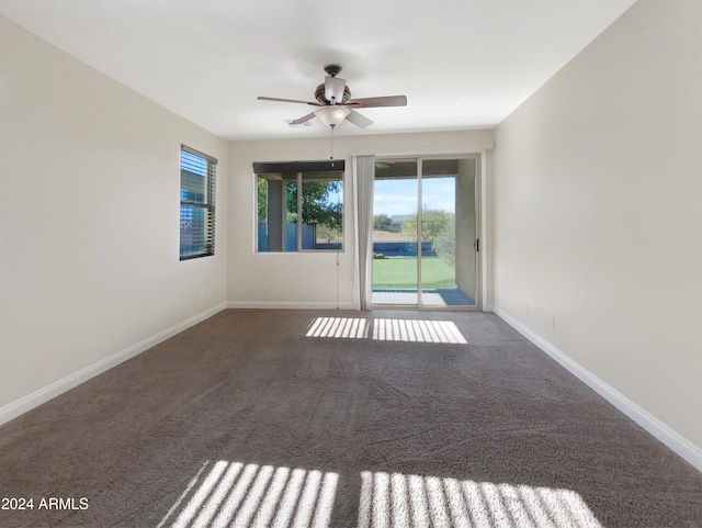 carpeted empty room with ceiling fan