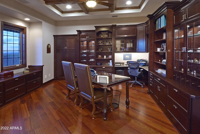 office space featuring beamed ceiling, dark hardwood / wood-style flooring, crown molding, and coffered ceiling