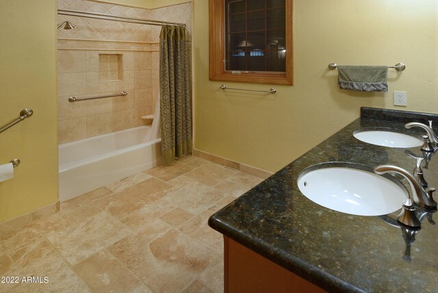 bathroom featuring vanity and shower / bath combo with shower curtain