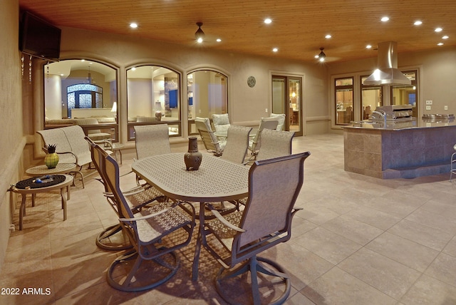 dining space featuring wood ceiling