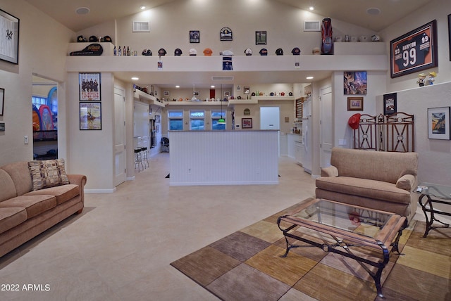 living room featuring high vaulted ceiling