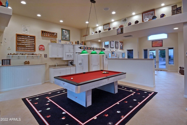 rec room featuring sink, light tile patterned floors, a high ceiling, and billiards