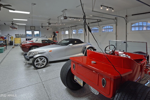 garage with ceiling fan and a garage door opener