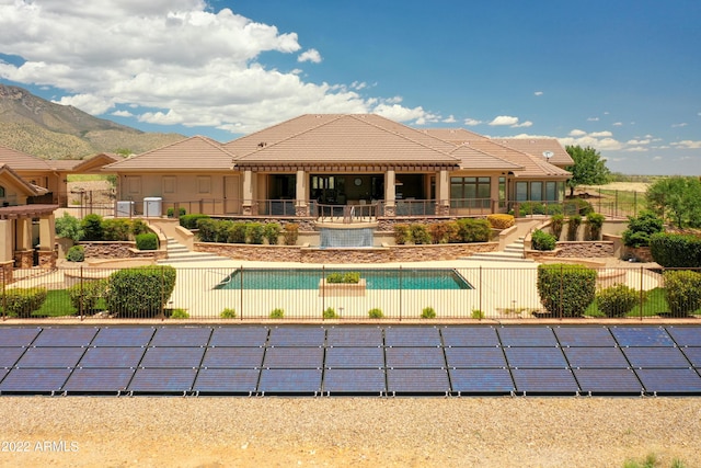 view of pool with a mountain view and a patio