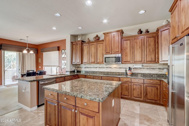 3660 S Golden Eye Ln, Gold Canyon, AZ 85118 - kitchen with a sink, brown cabinetry, appliances with stainless steel finishes, and a peninsula