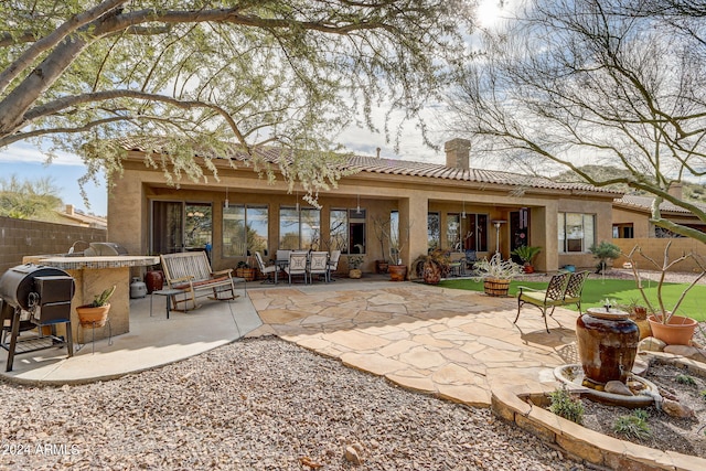 3660 S Golden Eye Ln, Gold Canyon, AZ 85118 - rear view of property with a chimney, stucco siding, a tile roof, and a patio area
