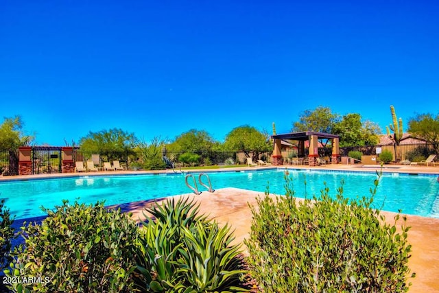 3660 S Golden Eye Ln, Gold Canyon, AZ 85118 - pool with a pergola, fence, and a patio