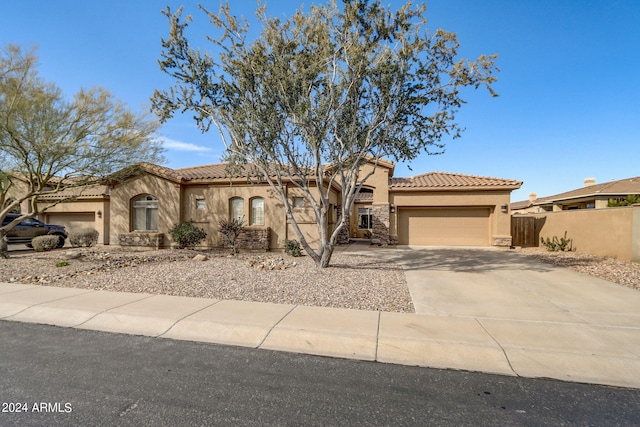 3660 S Golden Eye Ln, Gold Canyon, AZ 85118 - mediterranean / spanish-style home with stucco siding, driveway, a garage, and a tiled roof