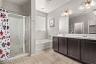 2614 S 120th Ave, Avondale, AZ 85323 - bathroom featuring a shower stall, tile patterned flooring, double vanity, and a bath