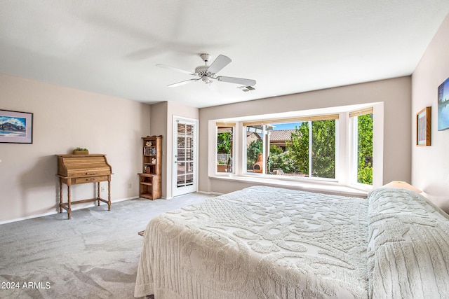 bedroom featuring light carpet and ceiling fan