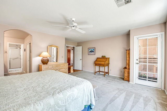 bedroom featuring light carpet, access to outside, and ceiling fan