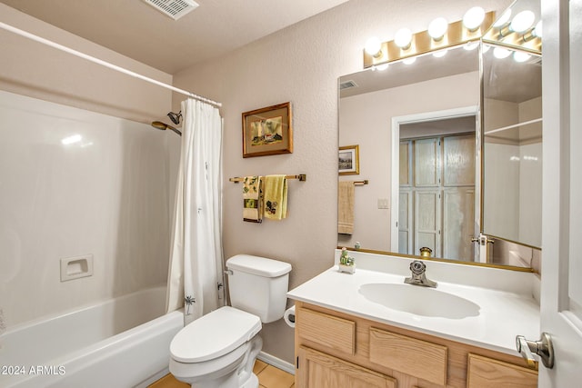 full bathroom with shower / tub combo with curtain, vanity, and toilet