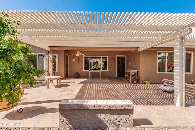 view of patio with ceiling fan and a pergola