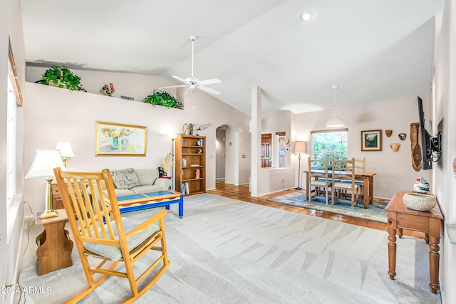 living room with lofted ceiling and ceiling fan