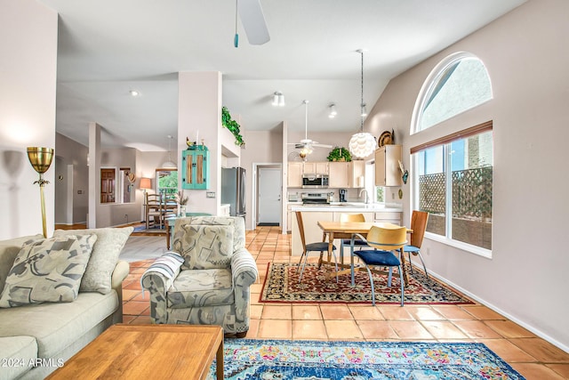 living room with light tile patterned flooring, sink, and ceiling fan