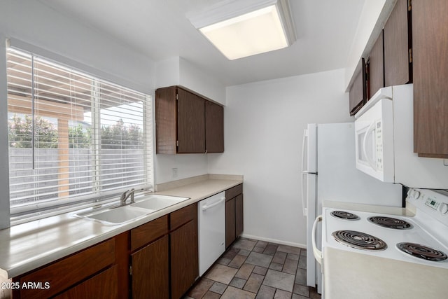 kitchen with white appliances and sink