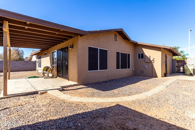 back of property featuring a patio area