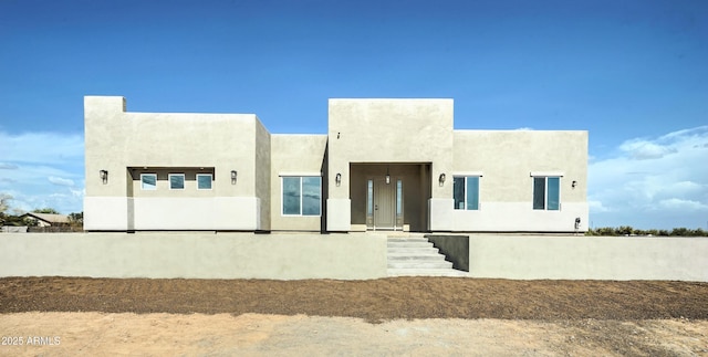 22009 W Montgomery Rd, Wittmann, AZ 85361 - pueblo-style house with stucco siding