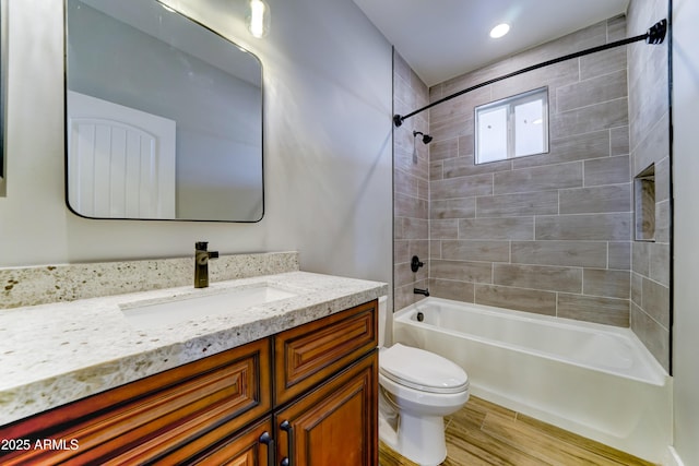 22009 W Montgomery Rd, Wittmann, AZ 85361 - full bath featuring toilet,  shower combination, vanity, and wood finished floors