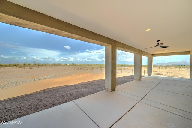 22009 W Montgomery Rd, Wittmann, AZ 85361 - view of patio / terrace with a ceiling fan and a view of rural / pastoral area