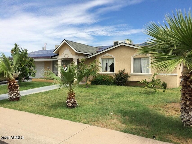 3116 W Dailey St, Phoenix, AZ 85053 - ranch-style home featuring solar panels, a garage, stucco siding, and a front lawn